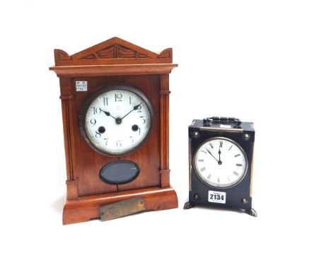 A Victorian ebonised mantel clock with white enamel dial on scroll brass feet, 16cm high, and another mantel clock with prese