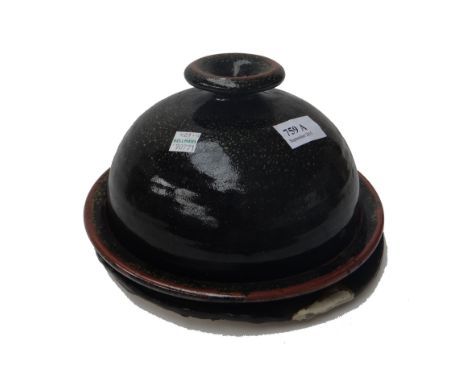 Five ceramic items, comprising; a tenmoku glazed stoneware cheese dish and cover, 23.5cm diameter, a stoneware jar by Leach p