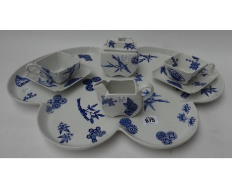 A Royal Worcester Aesthetic Movement blue and white part tête-a-tête, circa 1877, in Japanese taste, printed with bamboo and 