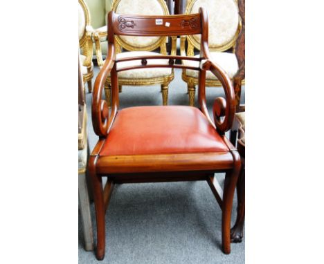 In the manner of Morgan & Sanders; a metamorphic mahogany library chair of early 19th century design.