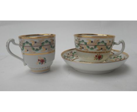 A porcelain trio, probably Worcester, early 19th century, painted with flower sprays and leaves in iron-red, purple, green an