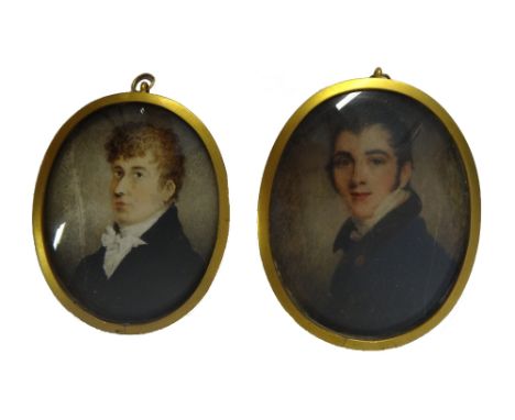 Early 19th century, English School, portrait miniature on ivory of a young gentleman wearing a black coat and a high collared