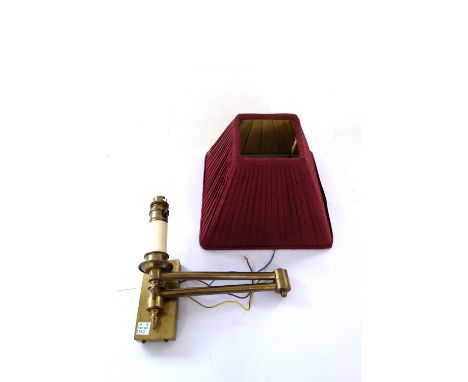 A pair of brass wall lights of Victorian style, with adjustable arms and red pleated shades, 52cm, together with two small si
