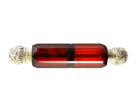 A Victorian silver mounted, double ended, faceted red glass smelling cum scent bottle, the mounts of spherical form, with fol