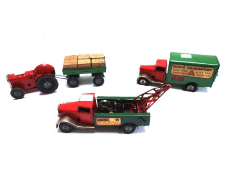 Five Triang Minic clockwork vehicles, comprising; an ambulance, a motor service breakdown lorry, a transport truck, a dairy l