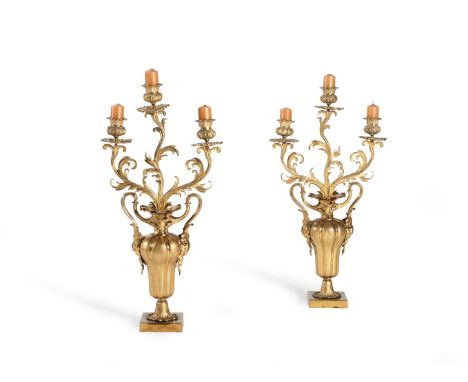 A PAIR OF LOUIS PHILIPPE GILT METAL THREE-LIGHT CANDELABRA SECOND QUARTER 19TH CENTURY The scrolling foliate arms issuing fro
