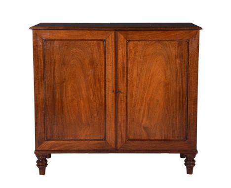 A REGENCY MAHOGANY PRESS CUPBOARDCIRCA 1820The panel doors enclosing three sliding trays100cm high, 110cm wide, 49cm deepProv