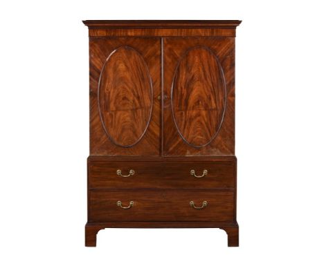 A MAHOGANY CLOTHES PRESS CIRCA 1800 AND LATERThe panel doors enclosing a hanging rail, the base with two long drawers185cm hi