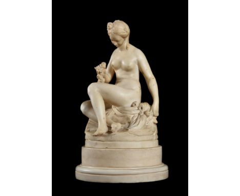 A SCULPTED MARBLE FIGURE OF A SEATED NUDEProbably emblematic of VenusApparently unsigned32.5cm high, base 19.5cm deep Provena