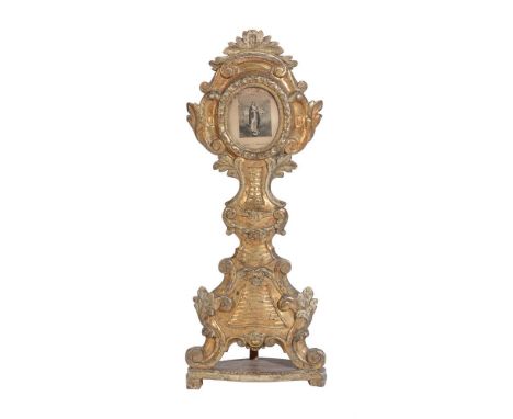 A GILTWOOD RELIQUARY SHRINE Inset with printed panel 'Maria V Immacolata' 78cm high, the base 31.5cm wide
