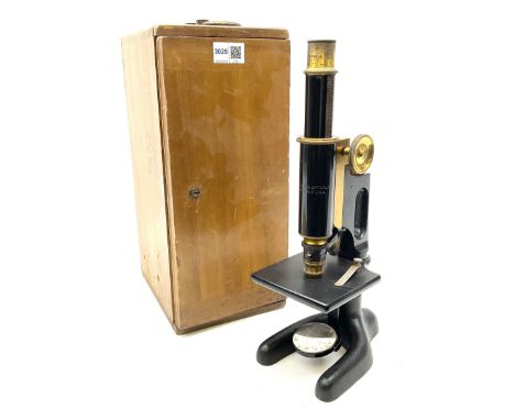 Brass and black enamelled monocular microscope by Bausch &amp; Lomb Rochester New York No.144787 on pitchfork base H32cm; in 