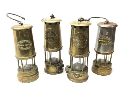 Four miner's lamps - two all brass by The Protector Lamp &amp; Lighting Co. Ltd.H25cm; and two (one all brass and one brass/s