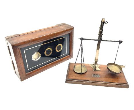 Set of brass and steel balance scales with rise-and-fall action on mahogany oblong base with moulded edge L21.5cm; and a Vict
