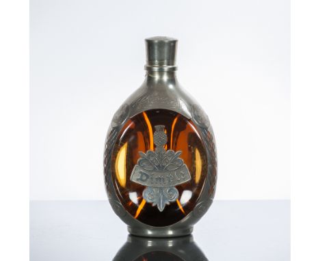 DIMPLE DE LUXE ROYAL DECANTER 
Blended Scotch Whisky by John Haig, aged 12 years. In bottle encased in Royal Holland Pewter. 