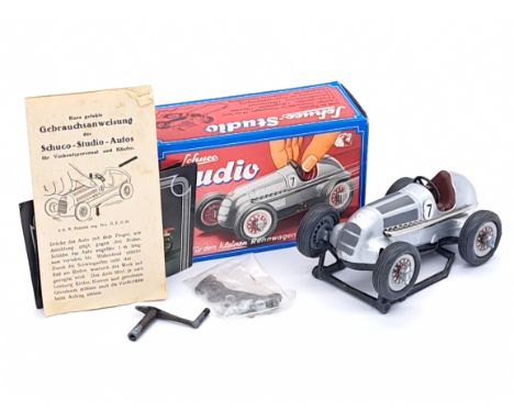 Schuco Studio Mercedes Racing Car, in silver with racing number 7, includes winding handle, stand, instructions, catalogue, s