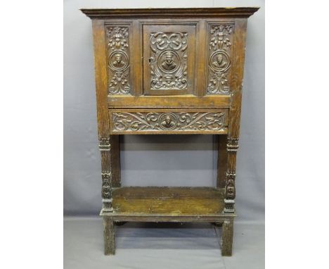 CONTINENTAL CARVED OAK &amp; PINE HUTCH CUPBOARD, linenfold detail to the sides with figural and head carved panels flanking 