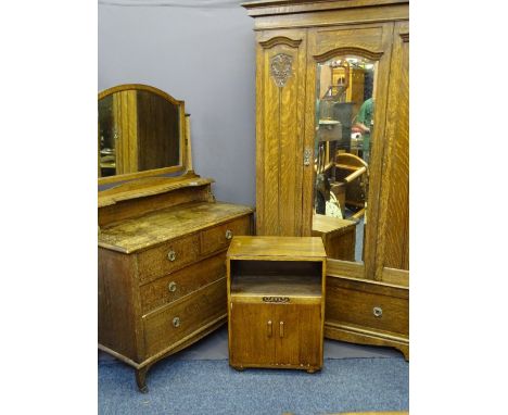 VINTAGE OAK THREE PIECE BEDROOM SUITE comprising single wardrobe with central mirrored door and lower drawer showing carved p