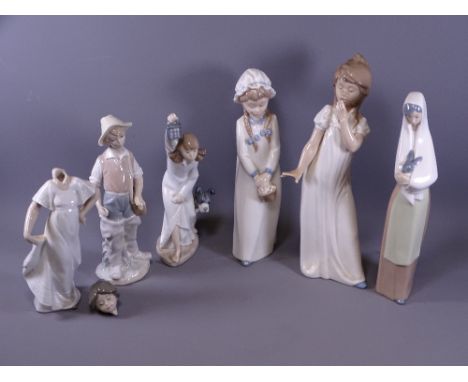 NAO GROUP OF GIRL FIGURINES along with a Lladro boy with fishing basket (some damages)