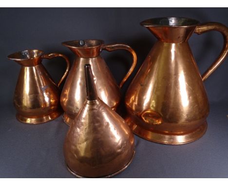 THREE COPPER BEER MEASURES, four gallon, two gallon and one gallon, complete with funnel (Provenance:  used over 100 years ag