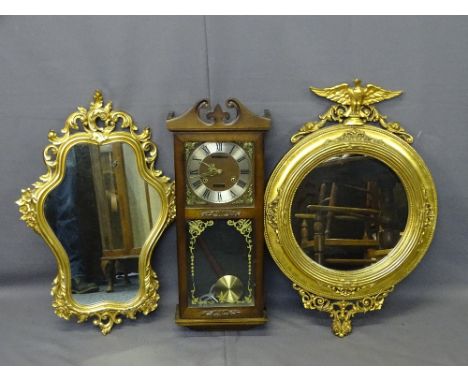 EAGLE TOP CLASSICAL STYLE CIRCULAR WALL MIRROR and one other together with a modern pendulum wall clock, 75cms, 73cms and 72c
