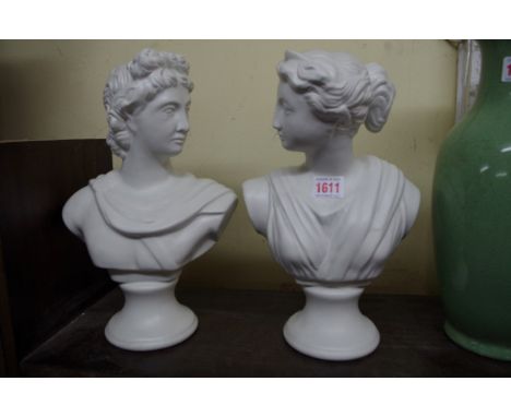 A pair of classical style pottery busts, 31cm high.