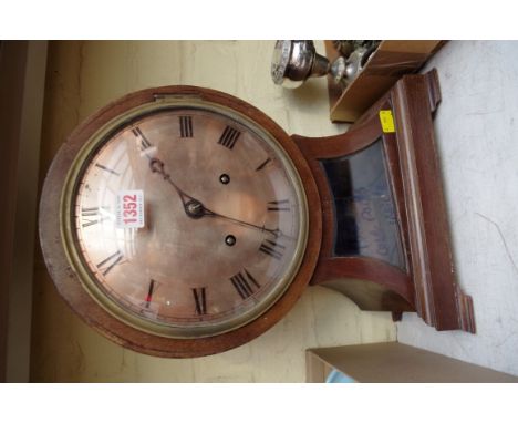 A late 19th century mahogany balloon mantel clock, 40cm high.  Condition Report: Dial requires re-silvering.  Measures 20.2cm