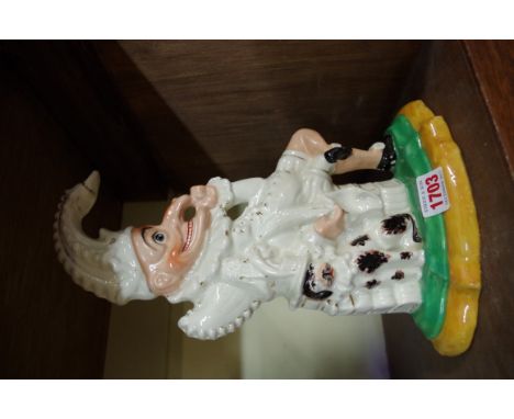 A Staffordshire pottery doorstop figure of Mr Punch, 29.5cm high.  Condition Report: No visible sign of chips, cracks or repa