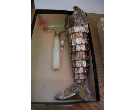 An abalone shell articulated fish, 20cm long; together with a blue glazed pottery necklace; and a nephrite roller.  