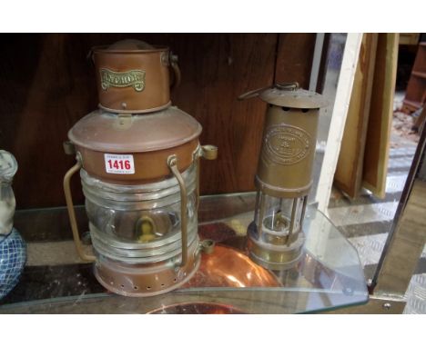 A ship's copper 'anchor' lamp; together with a brass miners lamp by Thomas & Williams, 