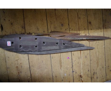 Ethnographica: two tribal carved wood paddle spears; together with four further spears. 