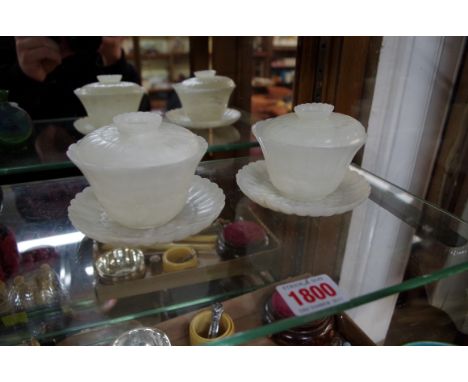 A pair of Chinese mottled white jade lotus bowls, covers and stands, 7cm high. Condition Report: Very good condition.  No sig