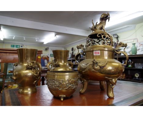A Chinese brass twin handled tripod censer and cover, Xuande six character mark, 45cm high; together with a similar pair of v