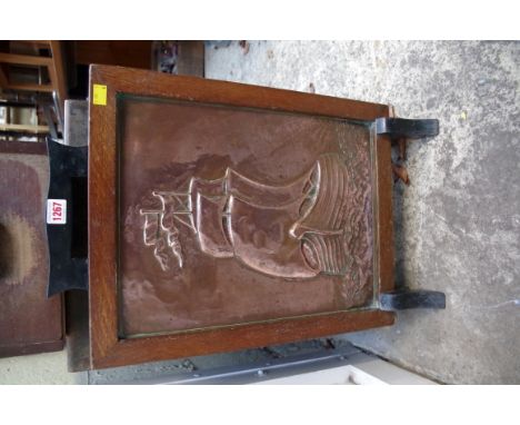 A art deco embossed copper and oak fire screen, 40.5cm wide. 