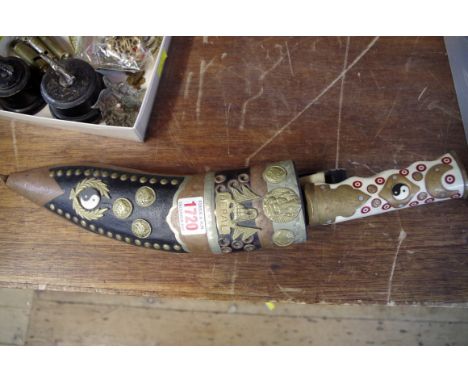 A Nepalese kukri and scabbard, with inlaid bone handle.  