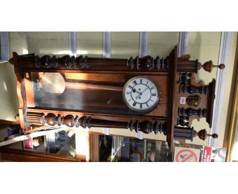 A late 19th century walnut Vienna style wall clock, with weight driven movement. 