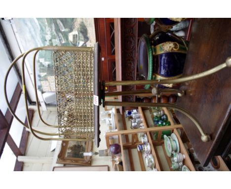 An old brass tripod magazine rack.
