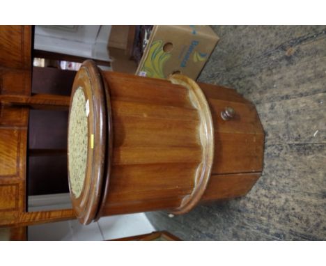 A Victorian mahogany library commode, the hinge top enclosing the original pottery liner.  