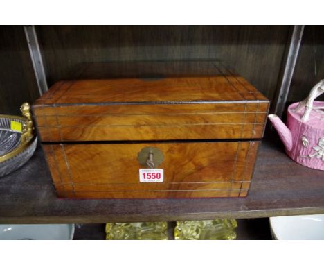 A Victorian walnut and brass strung sewing box, fitted interior incorporating a small quantity of mother of pearl tools, 27.5