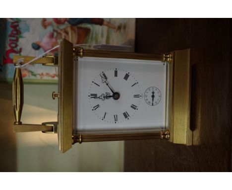 A good brass carriage clock, by Dent, with alarm and push button repeat, height including handle 19cm, with winding key.