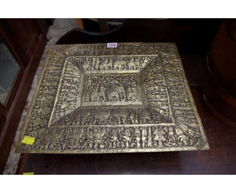 An Indian brass rectangular tray, embossed with figures and elephants, 36 x 40.5cm; together with an associated brass stand. 
