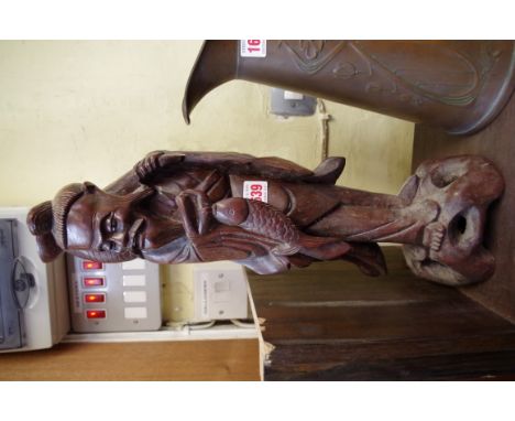 A Japanese carved wood figural lamp base.