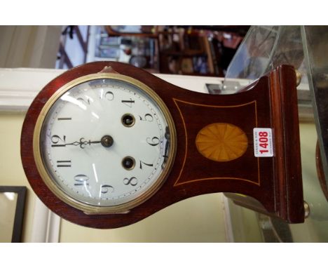 An Edwardian mahogany and inlaid balloon clock, 29cm high, (dial s.d.).