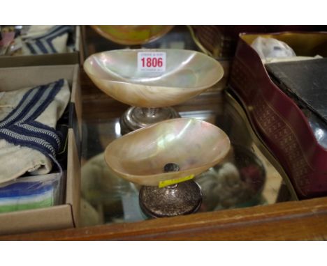 Two silver mounted mother of pearl dishes, largest 14cm wide. 