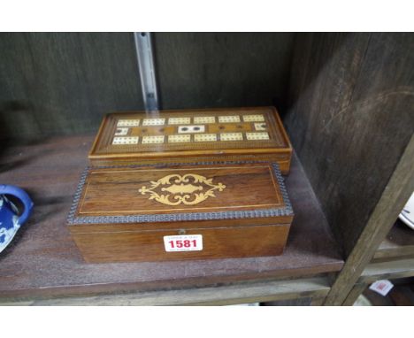 A 19th century inlaid cribbage board; together with a rosewood boxed set of bone and ebony dominoes. 