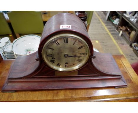 A 1920s mahogany Wellington clock, striking on five straight gongs, 52cm wide. 