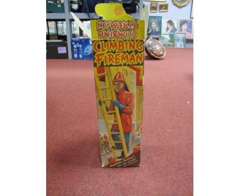 A Marx Tinplate Climbing Fireman, boxed. 