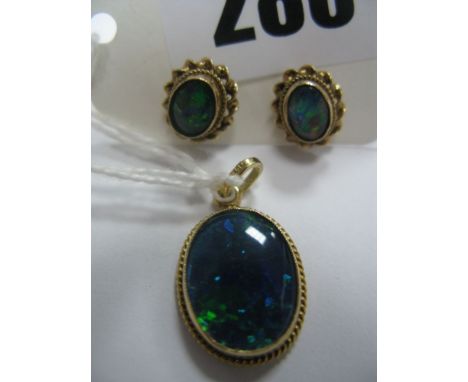 A Modern Opal (Doublet) Pendant, oval collet set; together with a pair of similar stud earrings.