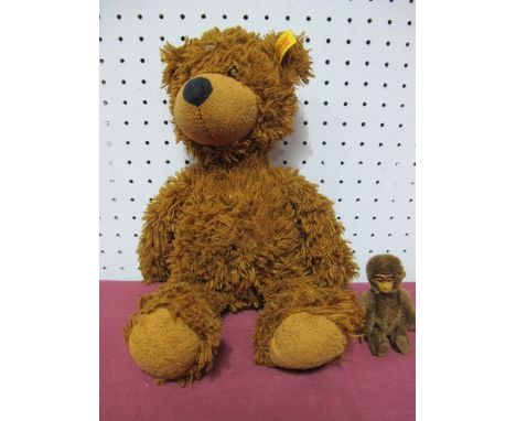 An Original Mohair Schuco Monkey, approximately 8.5cm high, jointed head, arms and legs, plus a modern Steiff bear.