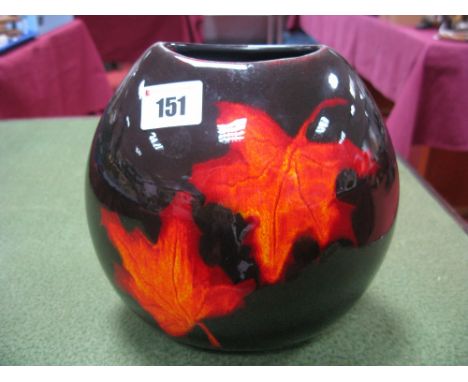 A Poole Pottery Ovoid Vase, decorated with flame coloured leaves on dark ground, 18cm high.