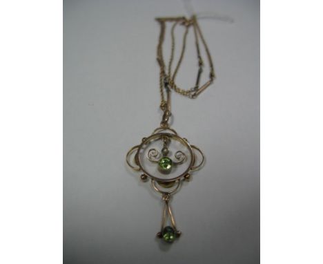 An Edwardian Openwork Pendant, oval and circular collet set, stamped "9ct"; on fancy link chain.